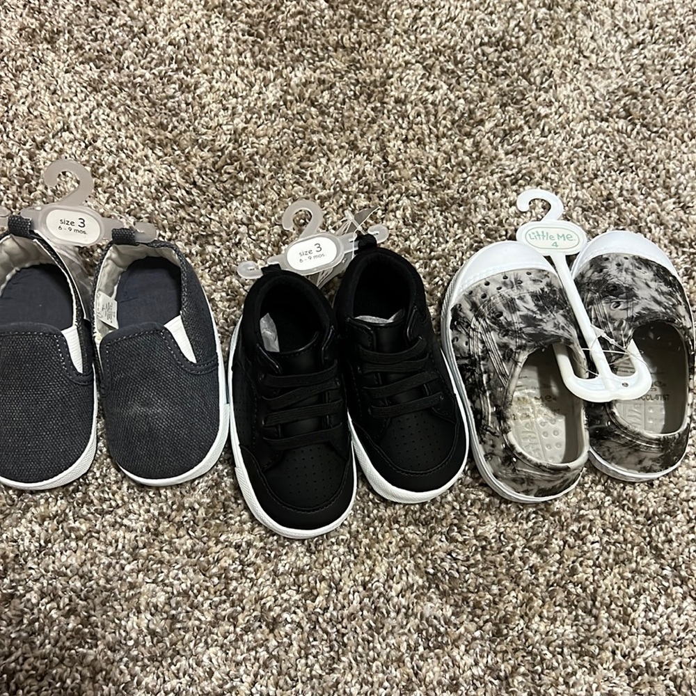 Never worn 2 size 3 (6-9m) shoes and one size 4